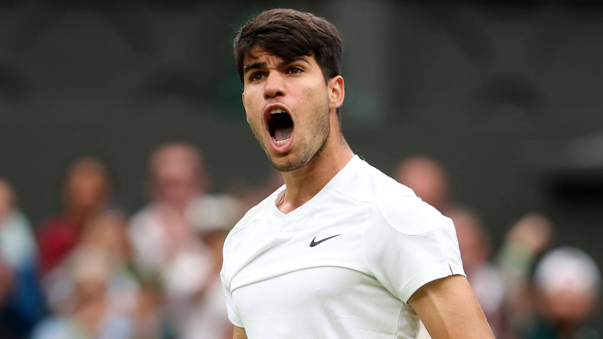 Carlos Alcaraz celebrates against Frances Tiafoe on Friday at Wimbledon.