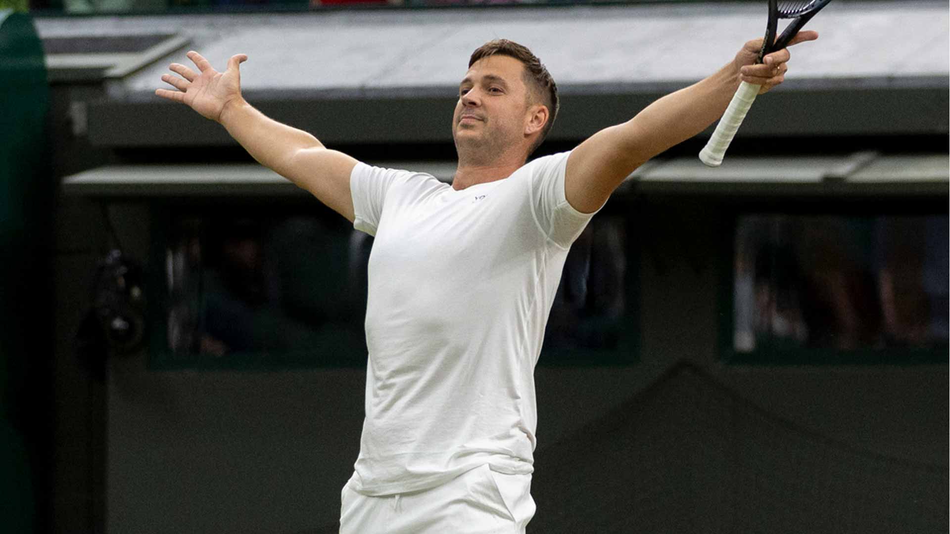 Marcus Willis celebrates during his first-round mixed doubles win at Wimbledon alongside Alicia Barnett.