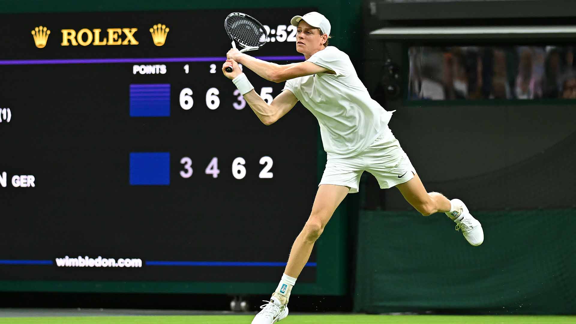 <a href='https://www.atptour.com/en/players/jannik-sinner/s0ag/overview'>Jannik Sinner</a> hits a backhand at <a href='https://www.atptour.com/en/tournaments/wimbledon/540/overview'>Wimbledon</a> 2024.