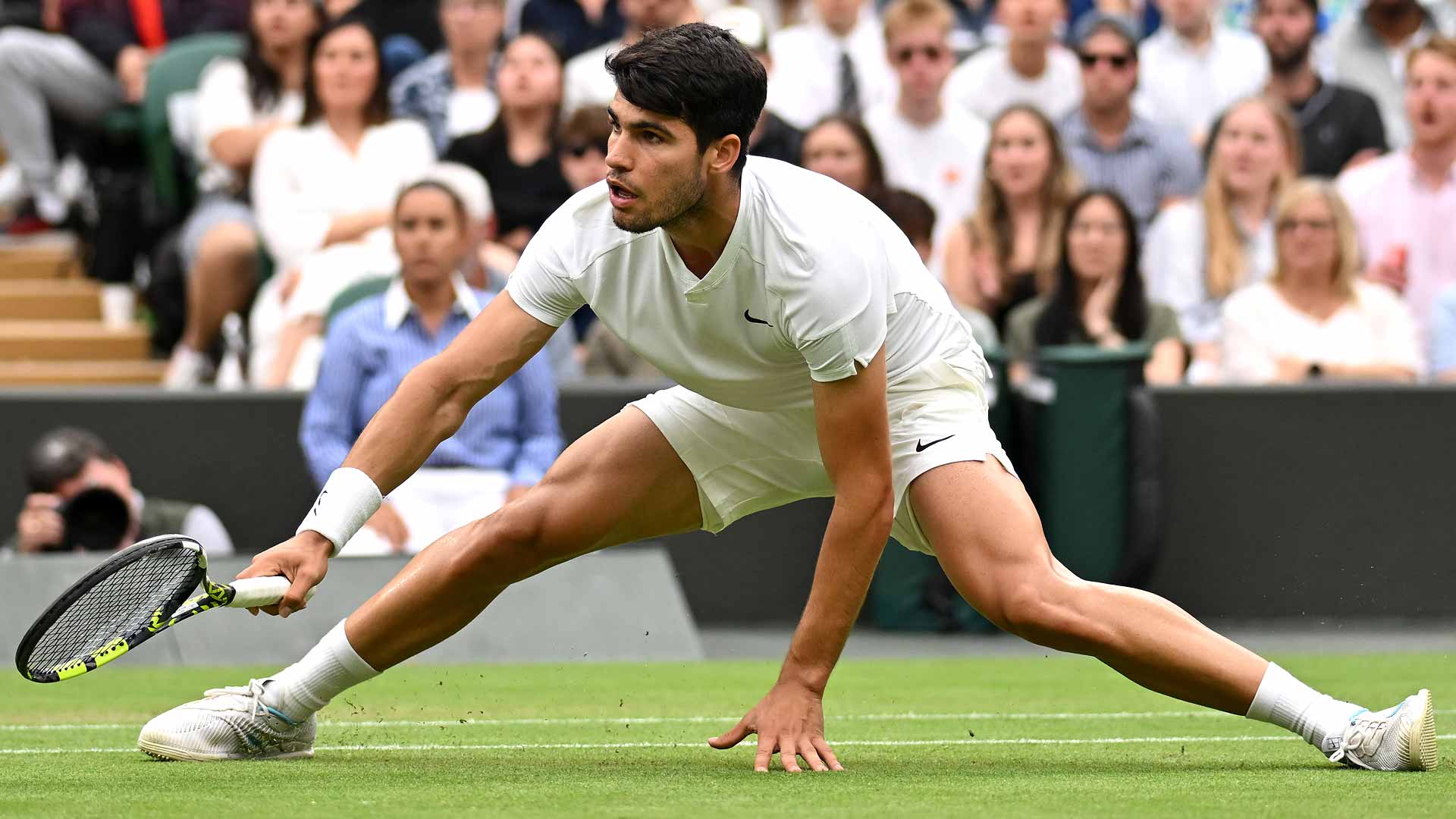 Carlos Alcaraz in quarter-final action against Tommy Paul on Tuesday at Wimbledon.
