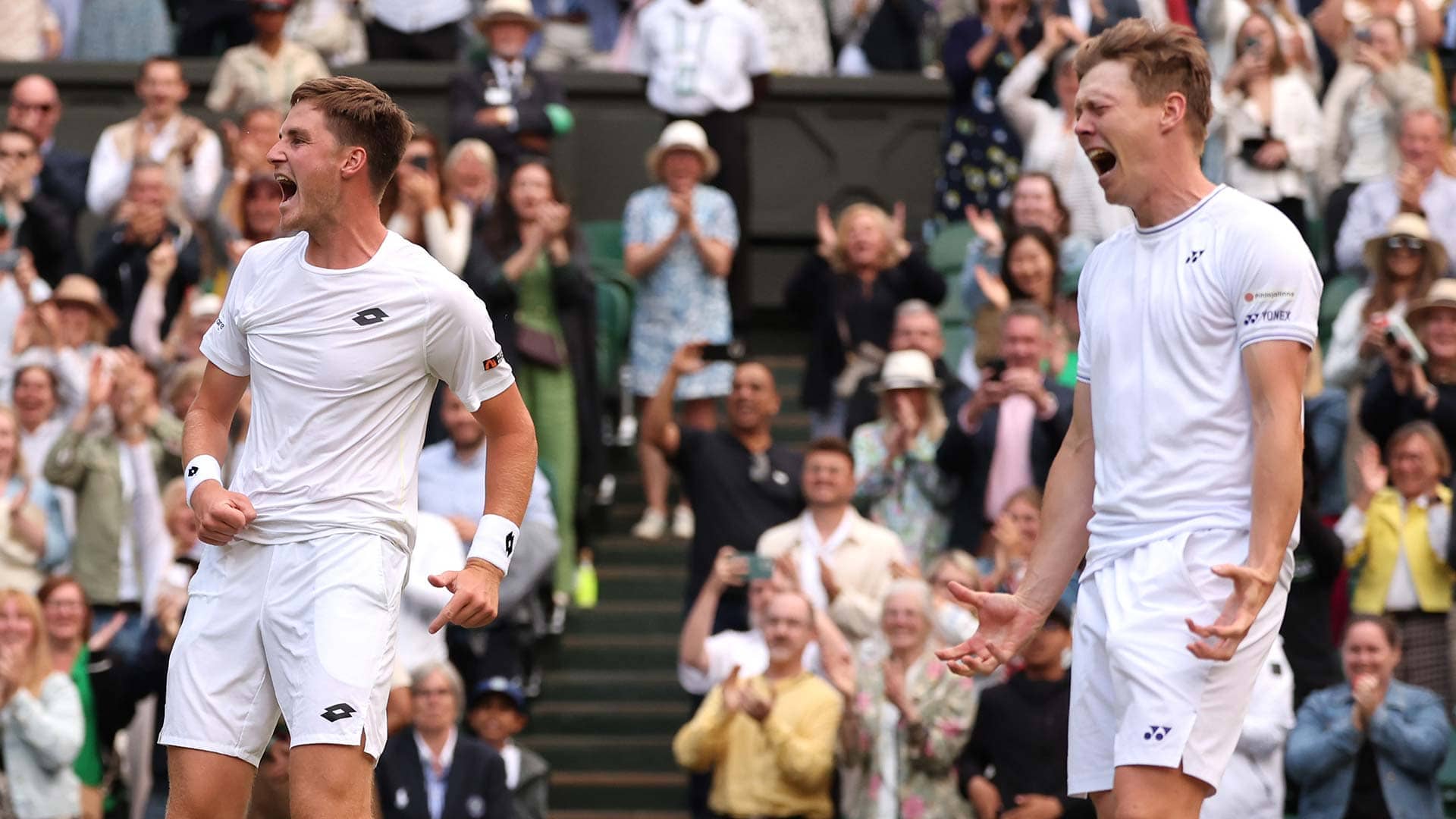 Henry Patten and Harri Heliovaara celebrate winning Wimbledon.