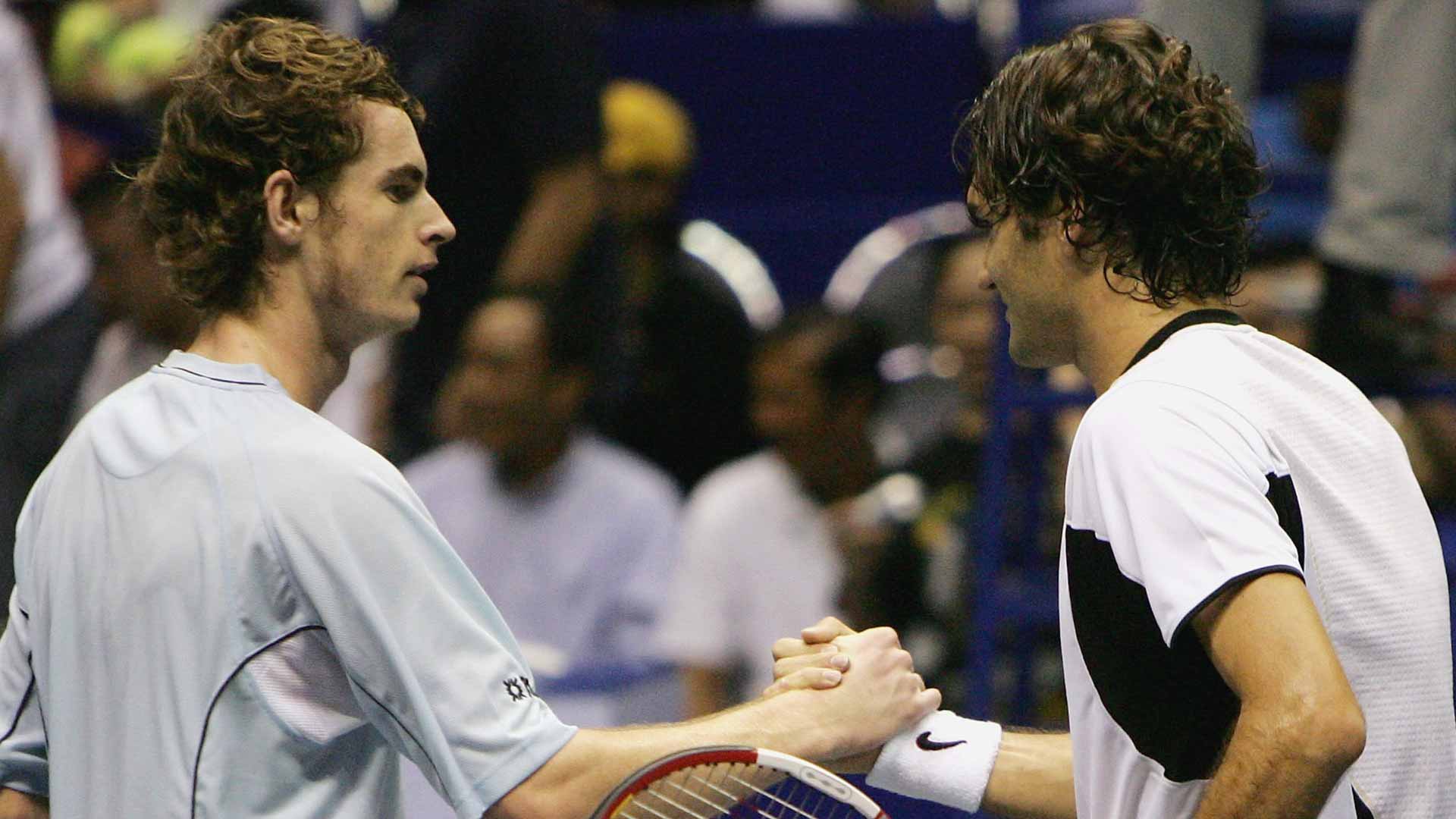 <a href='https://www.atptour.com/en/players/andy-murray/mc10/overview'>Andy Murray</a> and <a href='https://www.atptour.com/en/players/roger-federer/f324/overview'>Roger Federer</a> embrace after the 2005 Bangkok final.