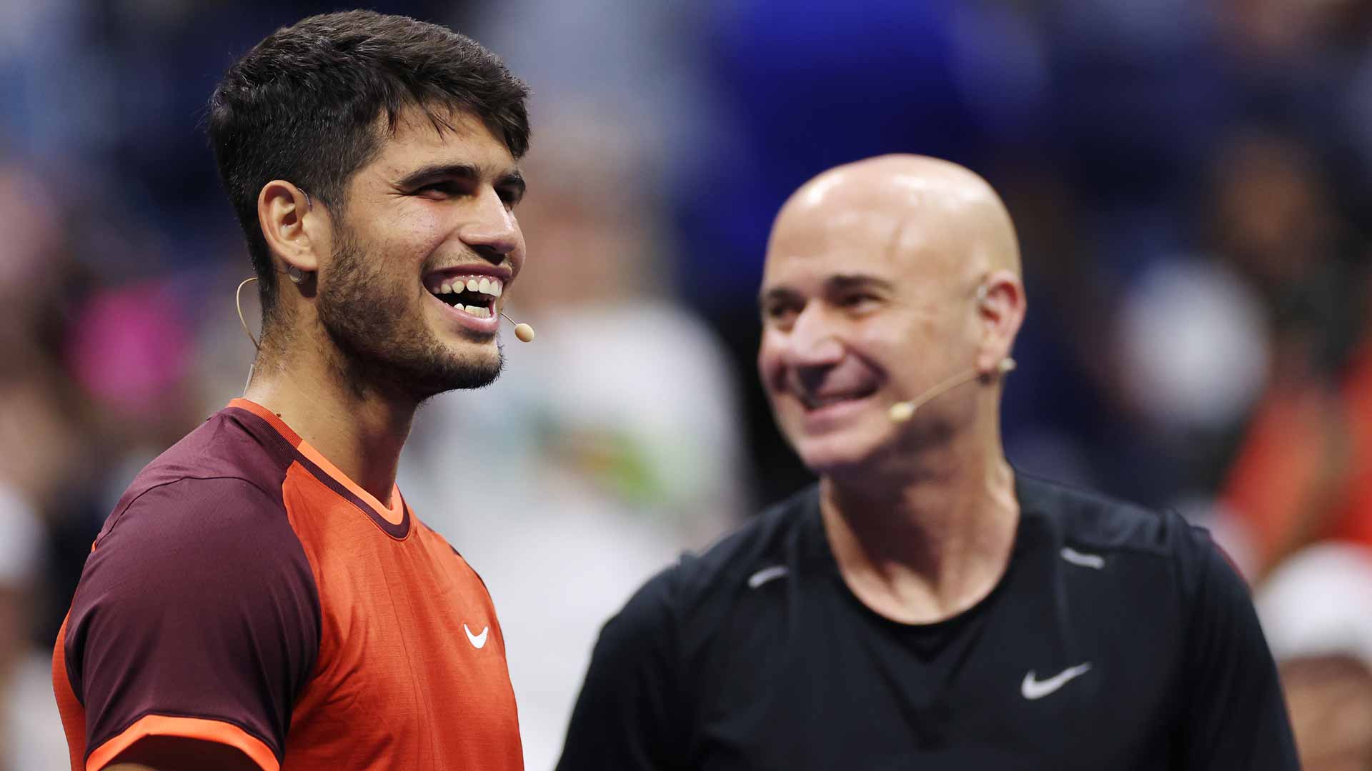 Carlos Alcaraz and Andre Agassi share a laugh Wednesday during Stars of the Open.