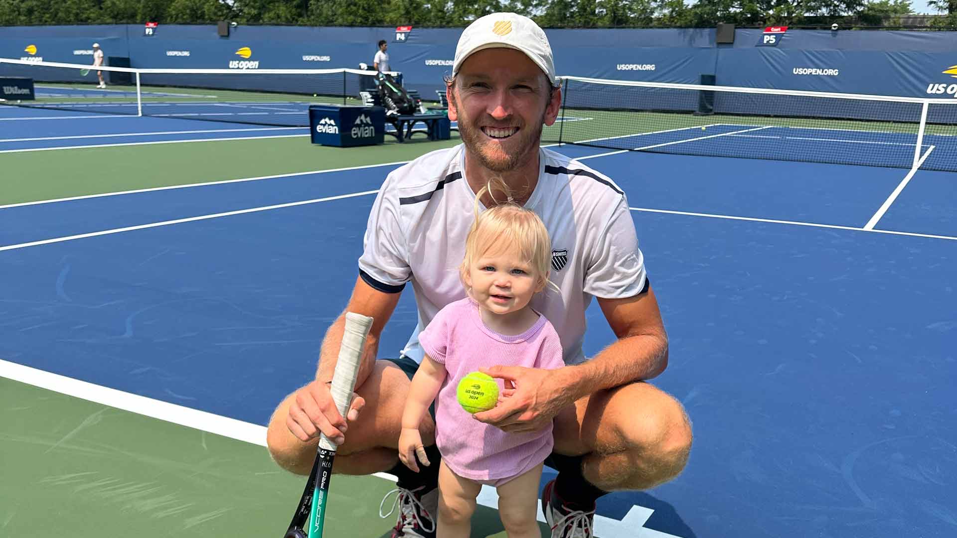 Mitchell Krueger with his daughter Camille on the practice courts ahead of the US Open.