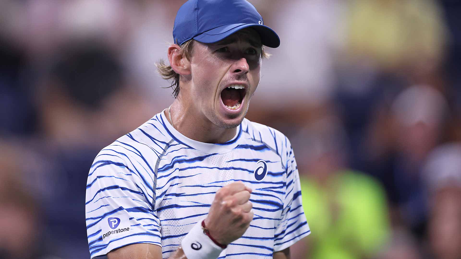 Alex de Minaur defeats Dan Evans in four sets to reach the US Open fourth round.