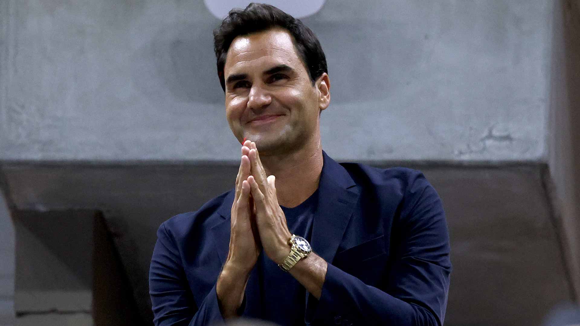Roger Federer waves to the crowd inside Arthur Ashe Stadium on Tuesday.