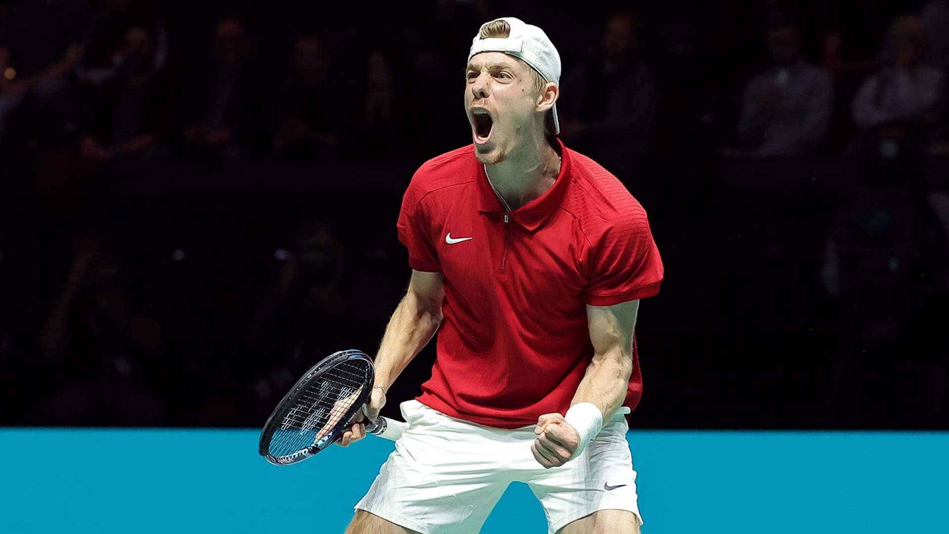 Denis Shapovalov celebrates in Manchester.