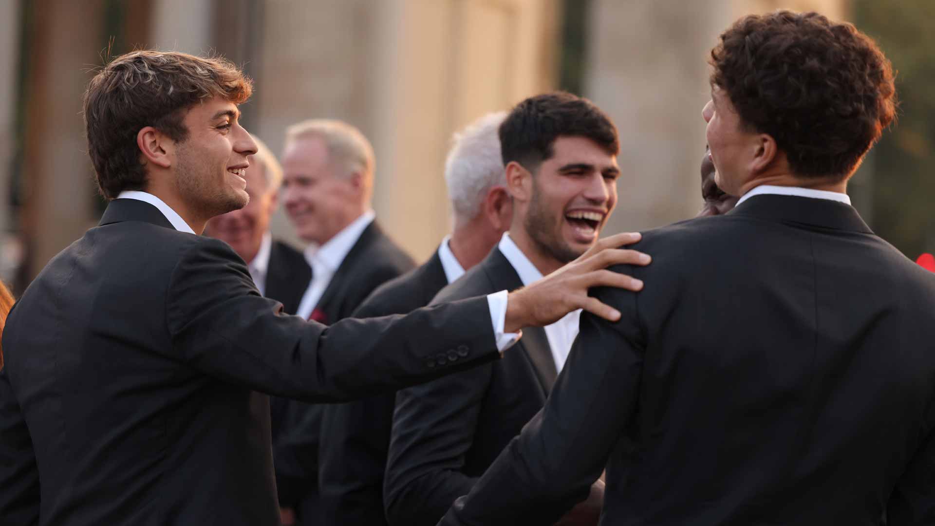 Team Europe's Flavio Cobolli and Carlos Alcaraz share a joke with Team World's Ben Shelton at the Laver Cup.