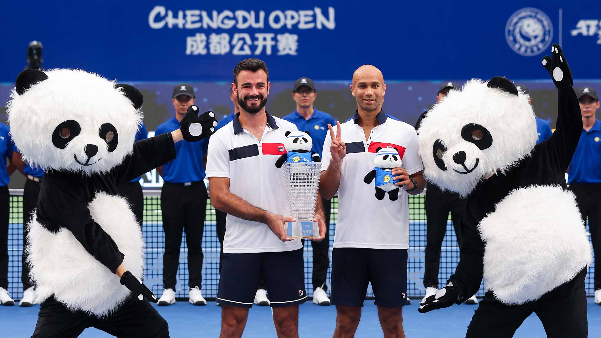 Fabien Reboul and Sadio Doumbia lift the doubles trophy at the Chengdu Open.