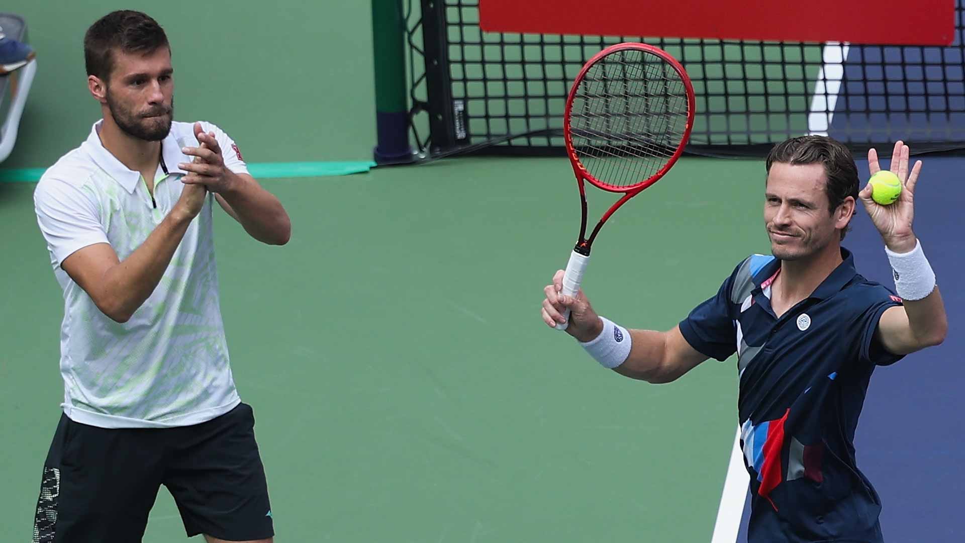 Nikola Mektic (left) and Wesley Koolhof celebrate their quarter-final victory Thursday in Shanghai.