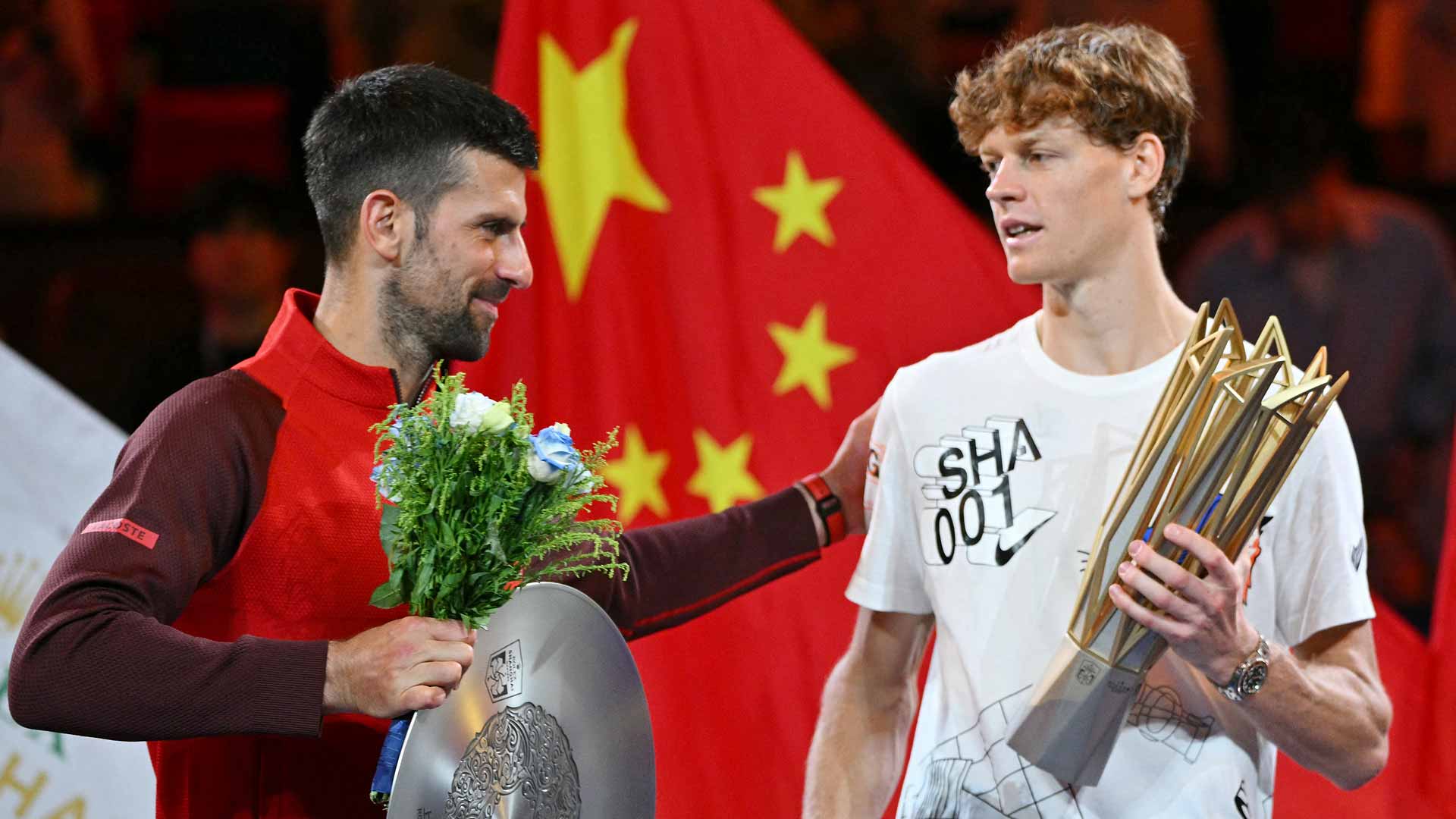 Novak Djokovic and Jannik Sinner at the Rolex Shanghai trophy ceremony on Sunday.