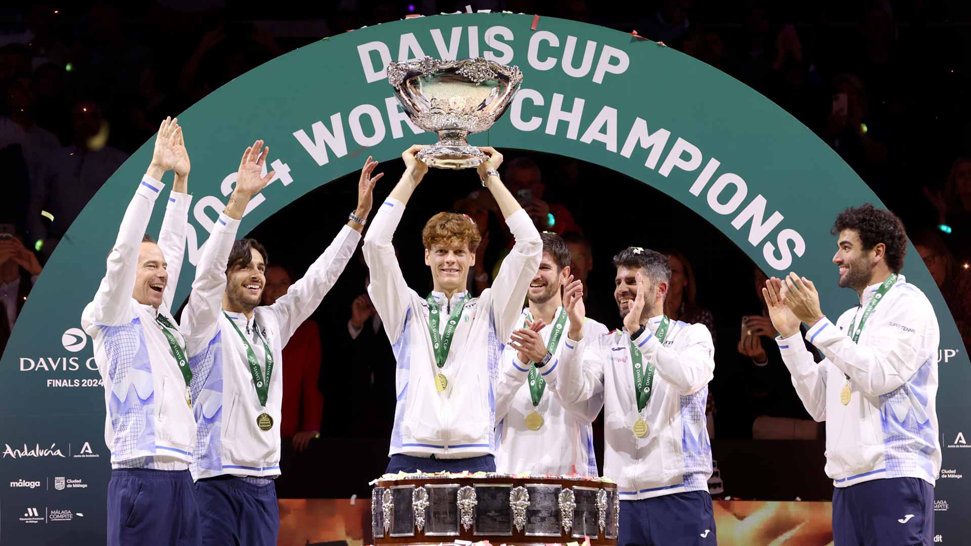 Jannik Sinner lifts the Davis Cup trophy alongside his Italian teammates on Sunday in Malaga.