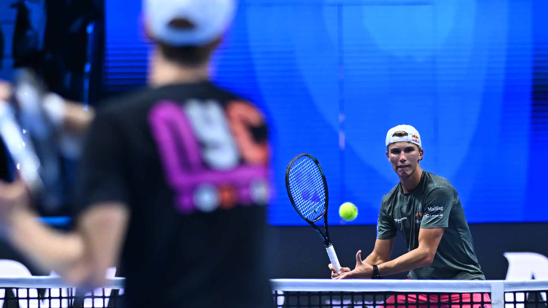 <a href='https://www.atptour.com/en/players/jannik-sinner/s0ag/overview'>Jannik Sinner</a> and <a href='https://www.atptour.com/en/players/nicolai-budkov-kjaer/b0u4/overview'>Nicolai Budkov Kjaer</a> practise in Turin.