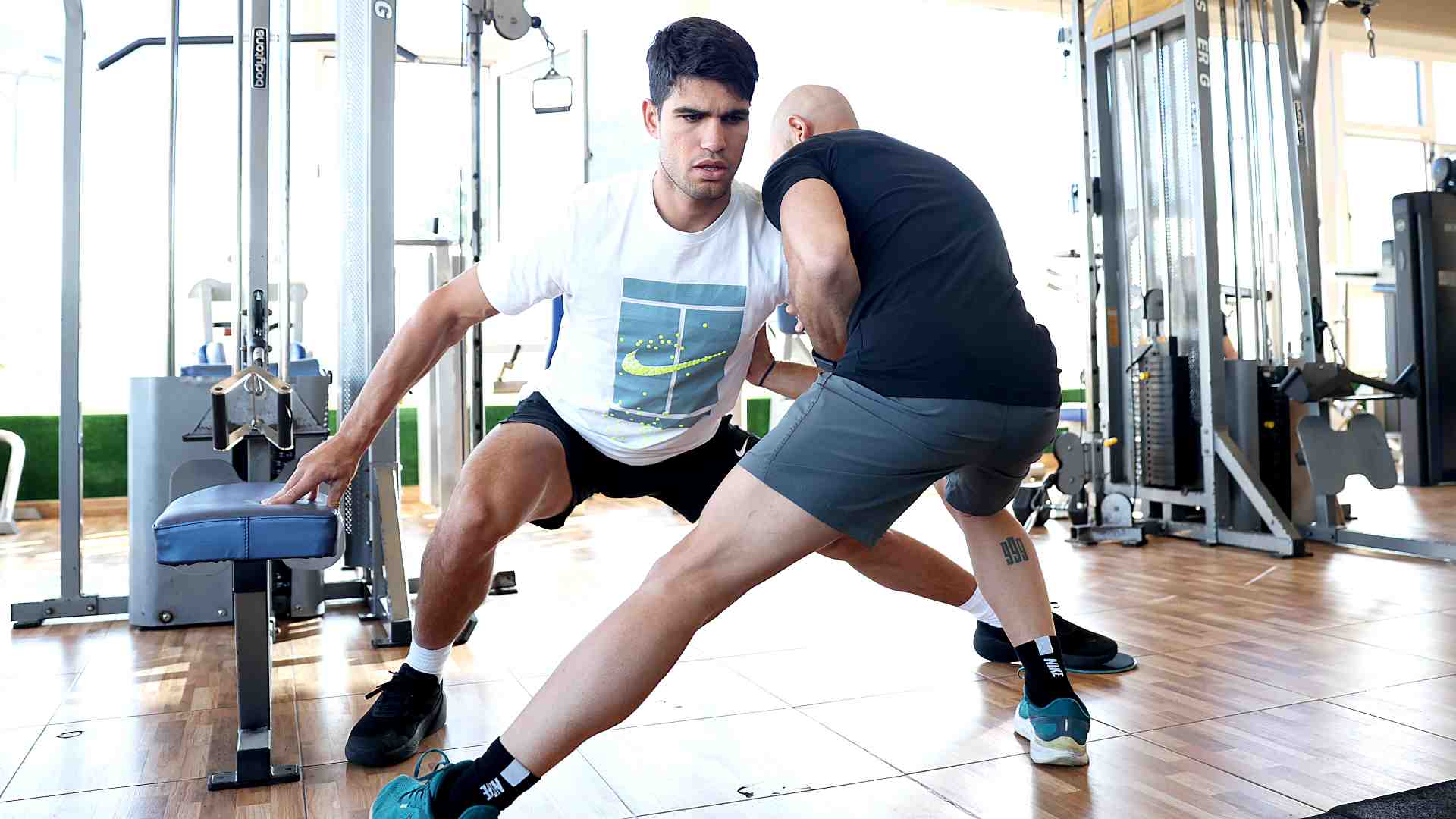 Alcaraz works with his physical trainer Alberto Lledo in the Club De Campo gymnasium.