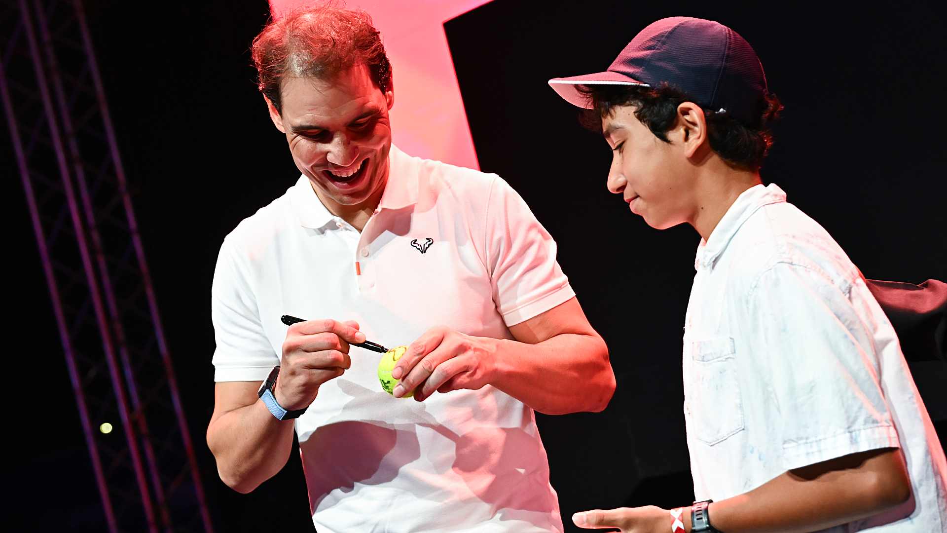 Nadal with a fan in the fan zone.