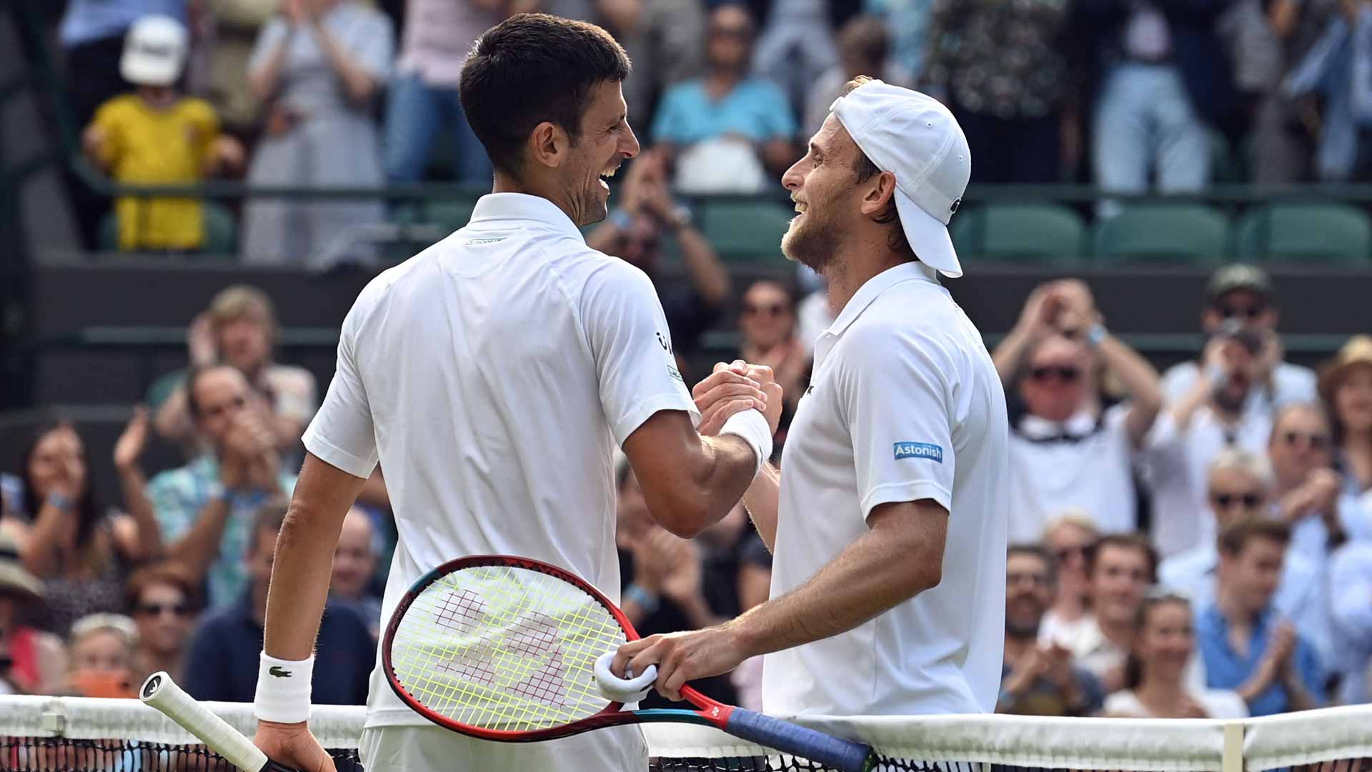 <a href='https://www.atptour.com/en/players/novak-djokovic/d643/overview'>Novak Djokovic</a> and <a href='https://www.atptour.com/en/players/denis-kudla/kb09/overview'>Denis Kudla</a> after their match at <a href='https://www.atptour.com/en/tournaments/wimbledon/540/overview'>Wimbledon</a> in 2021.