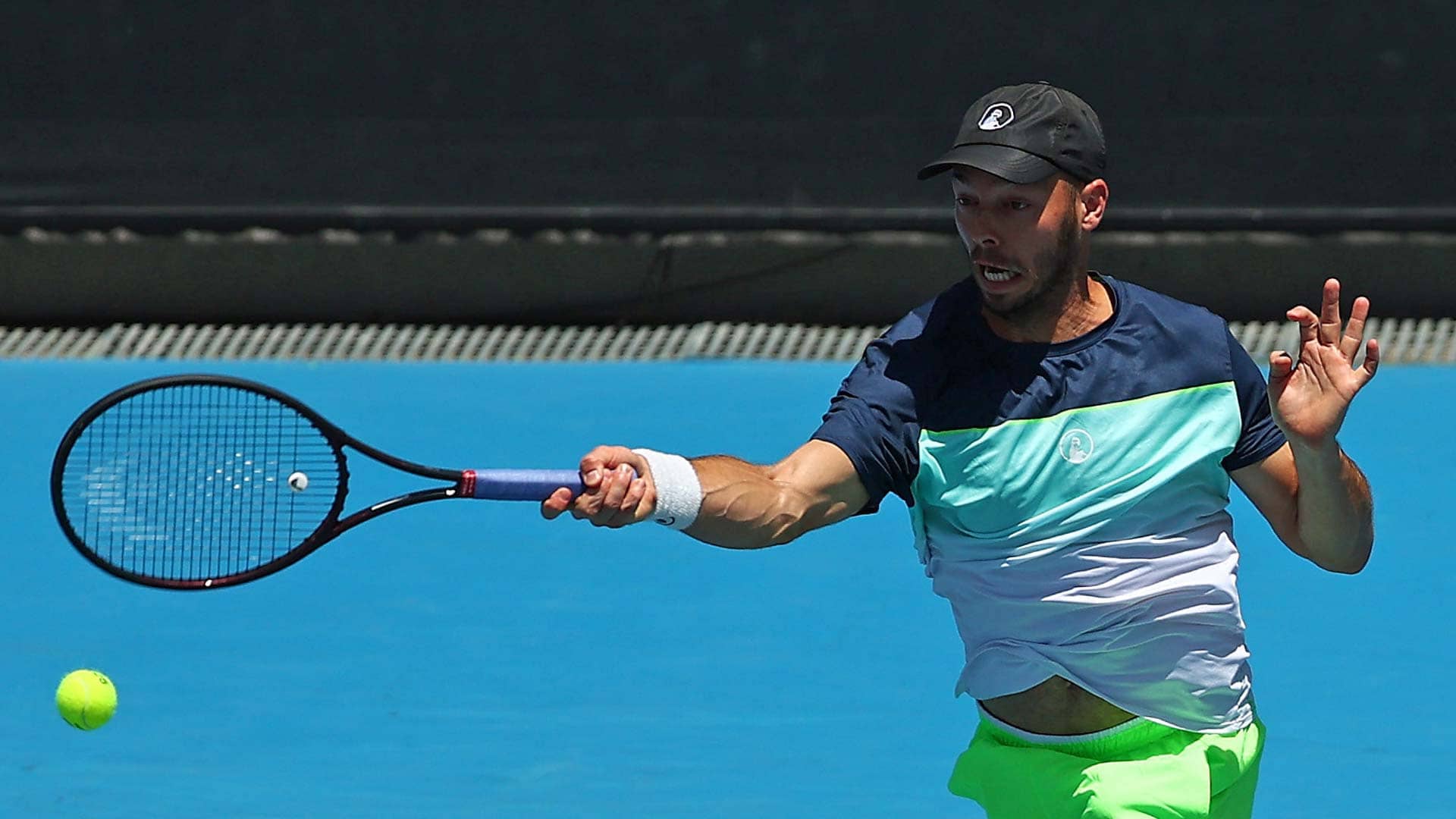 Tim Puetz comes to the aid of a ballkid at the Australian Open.