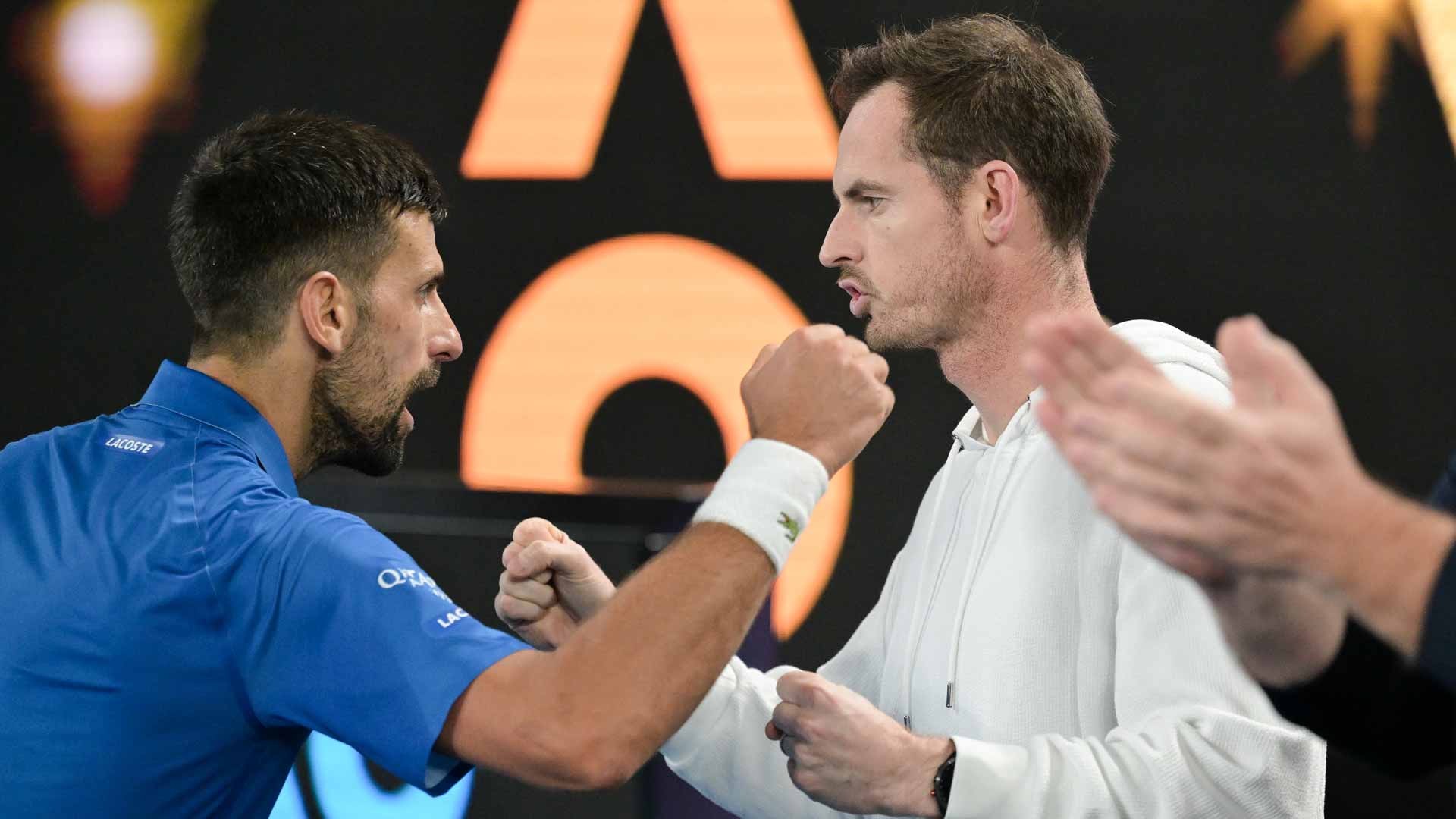 Novak Djokovic embraces Andy Murray after his quarter-final win against Carlos Alcaraz in Melbourne.
