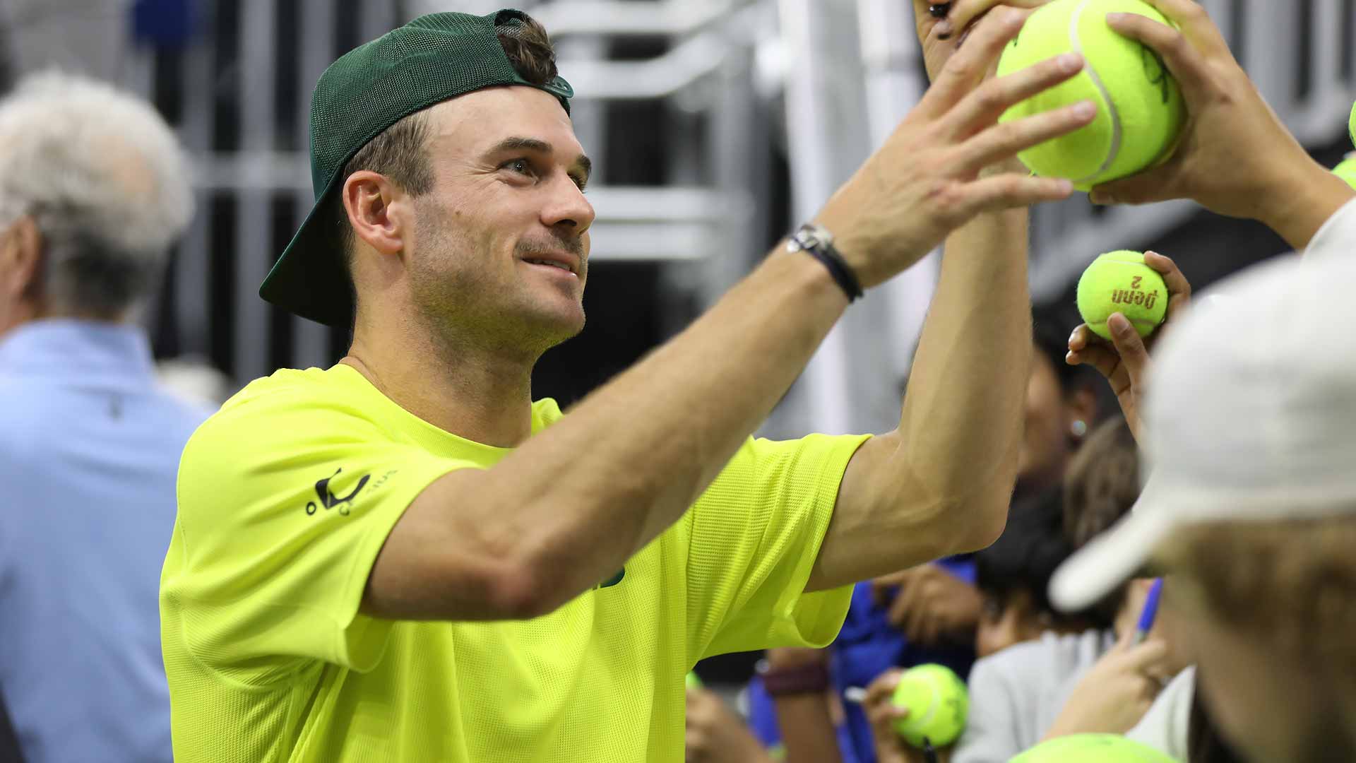 Tommy Paul signs an autograph after defeating Jenson Brooksby in three sets on Tuesday in Dallas.