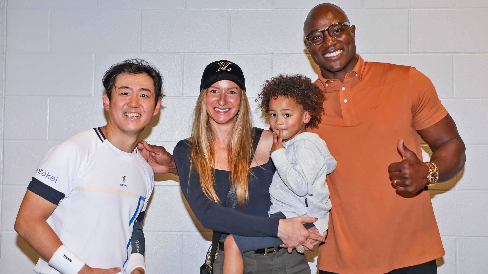 Yoshihito Nishioka meets NFL legend DeMarcus Ware and his family on Thursday in Dallas.