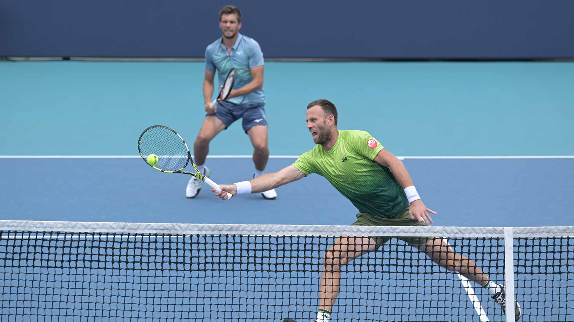 Nikola Mektic and Michael Venus in action on Sunday at the Miami Open presented by Itau.