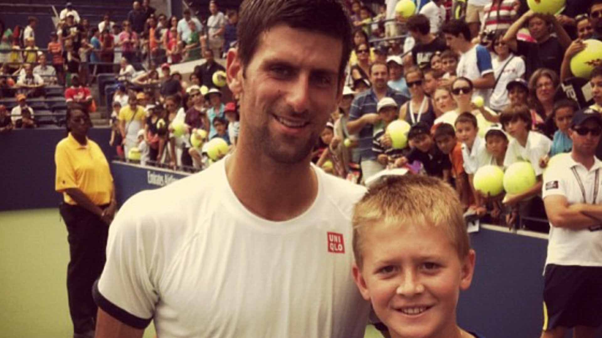 Novak Djokovic and a young Sebastian Korda pose for a photo at the US Open.