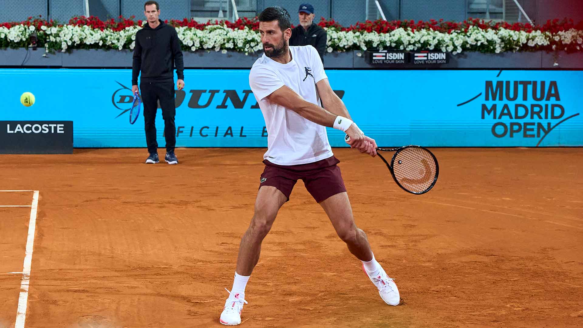 Novak Djokovic trains under the watchful eye of coach Andy Murray on Saturday in Madrid.