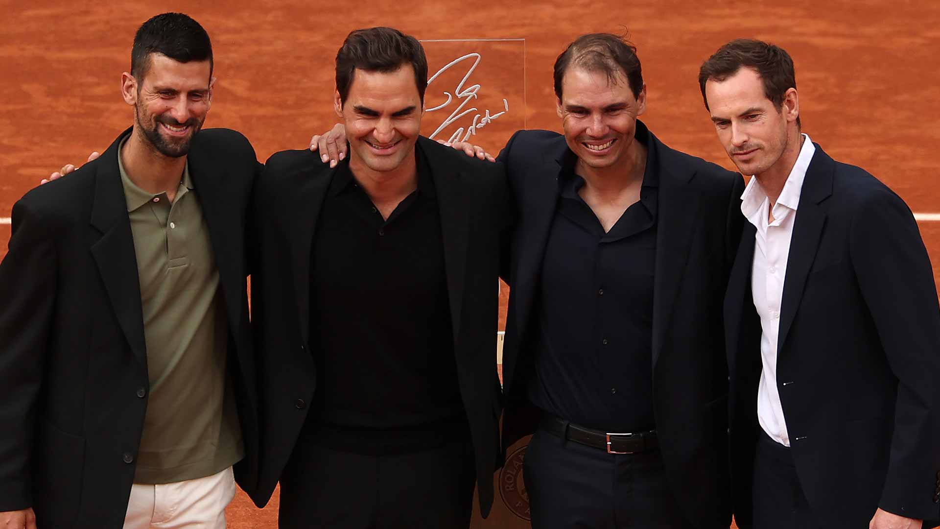 Novak Djokovic, Roger Federer and Andy Murray help celebrate Rafael Nadal during a special ceremony on Sunday in Paris.