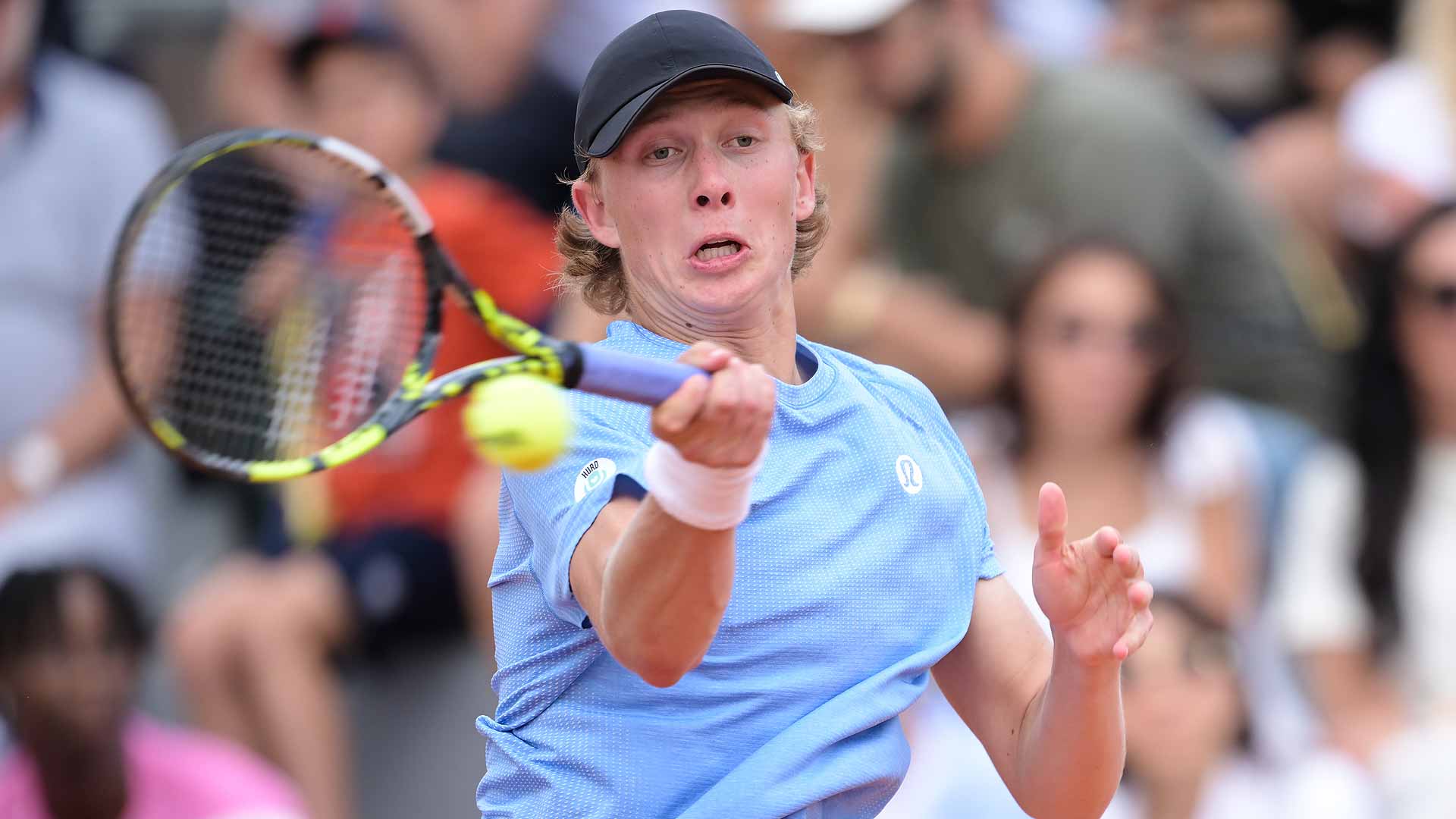 Ethan Quinn defeats Alexander Shevchenko in five sets Thursday at Roland Garros.