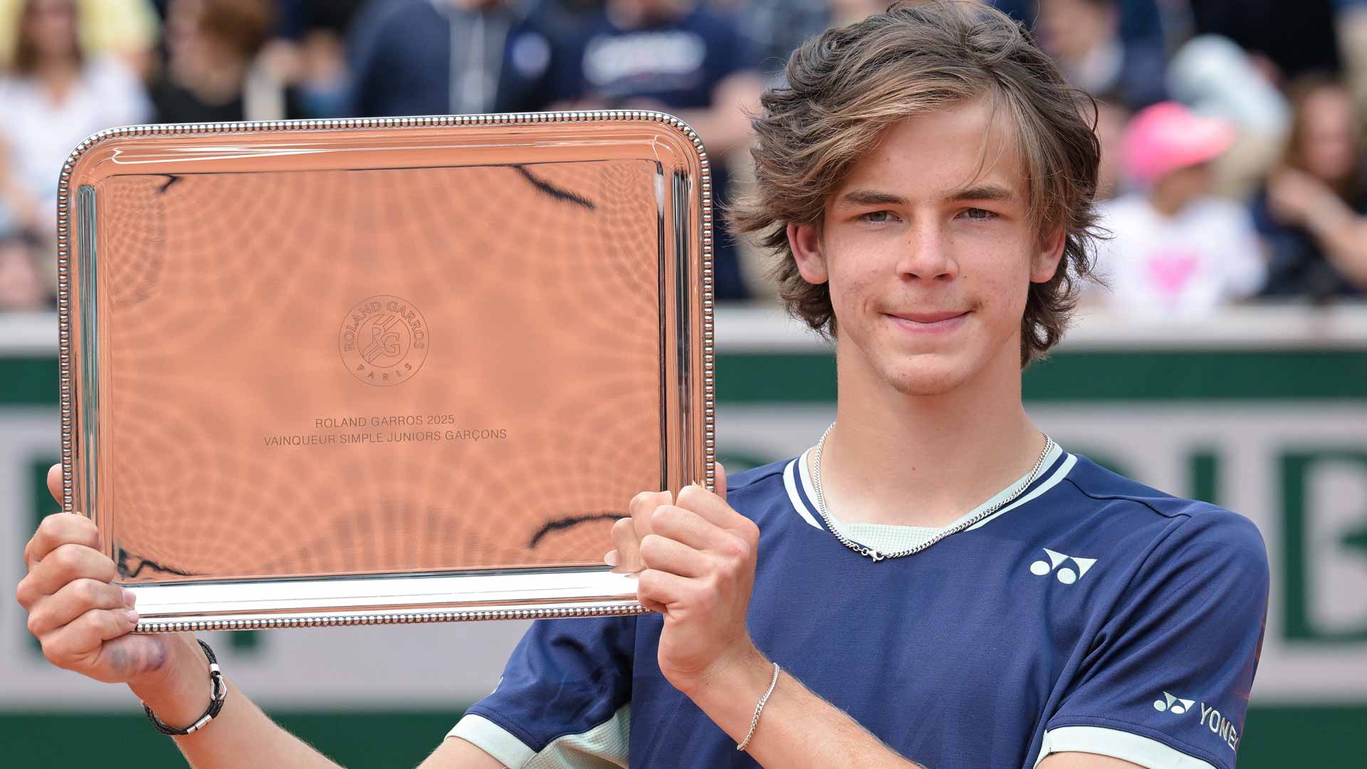 After helping secure Petzschner's haircut, McDonald wins Roland Garros boys' title