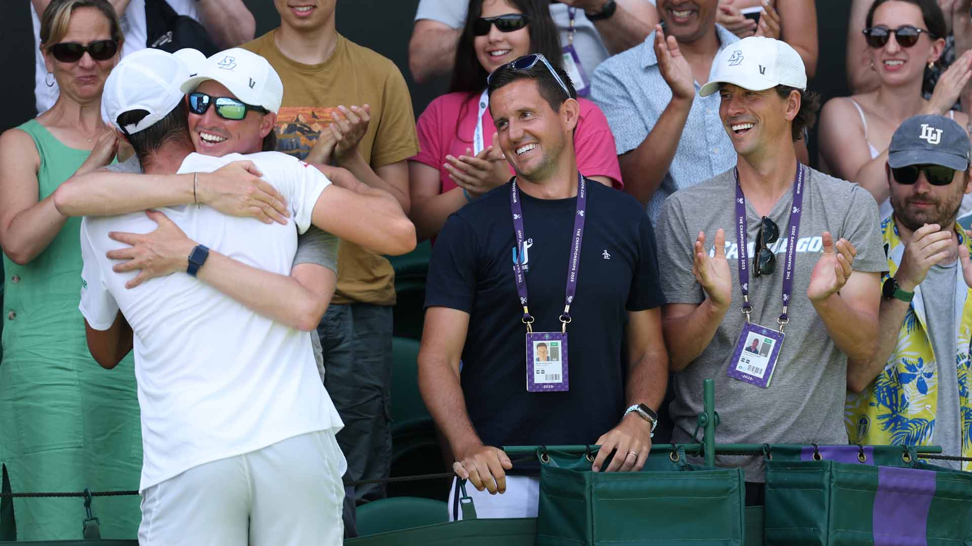 Ryan Keckley (right, in gray) celebrates <a href='https://www.atptour.com/en/players/oliver-tarvet/t0gr/overview'>Oliver Tarvet</a>'s first-round win at <a href='https://www.atptour.com/en/tournaments/wimbledon/540/overview'>Wimbledon</a>.