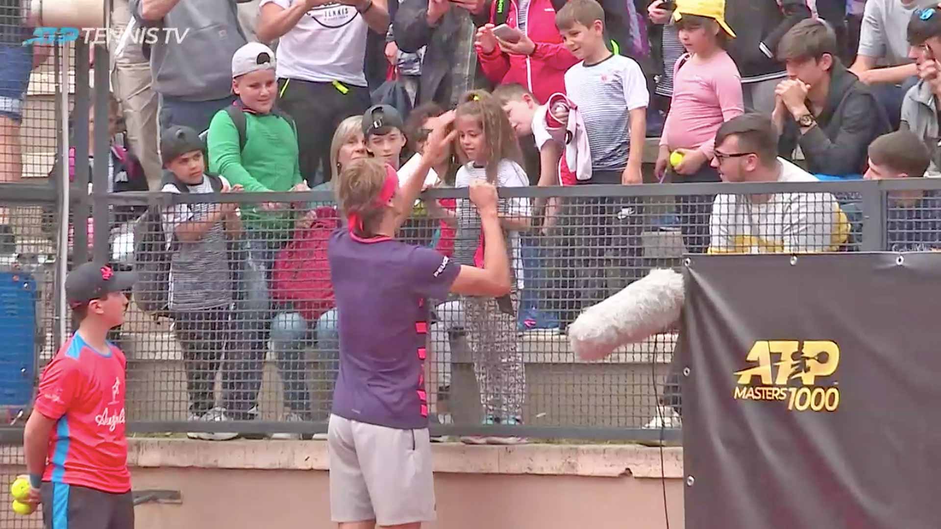 Zverev gives a fan a headband in Rome