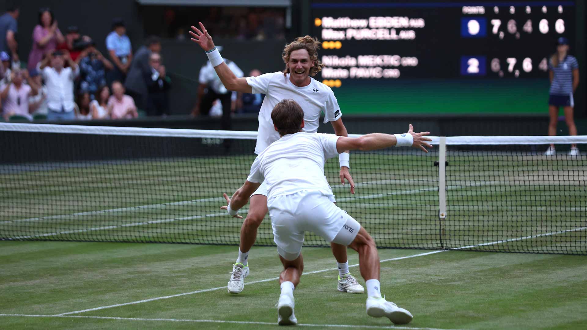 Max Purcell and Matthew Ebden celebrate winning the 2022 Wimbledon doubles title.