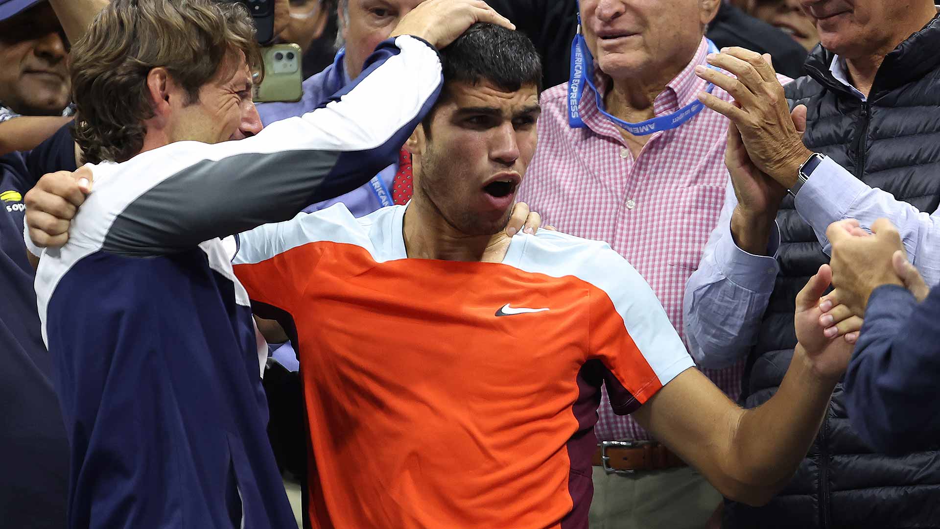 Carlos Alcaraz celebrates with his team, including coach Juan Carlos Ferrero.