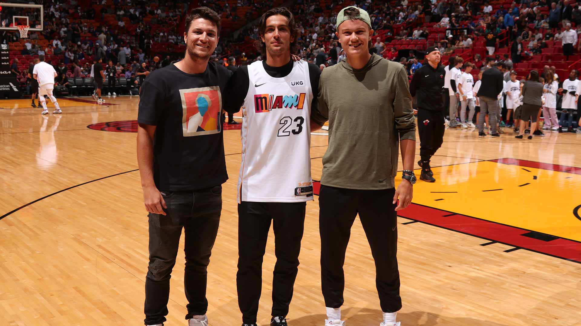 Miomir Kecmanovic, Lorenzo Musetti and Holger Rune attend Wednesday's Miami Heat game against the New York Knicks.