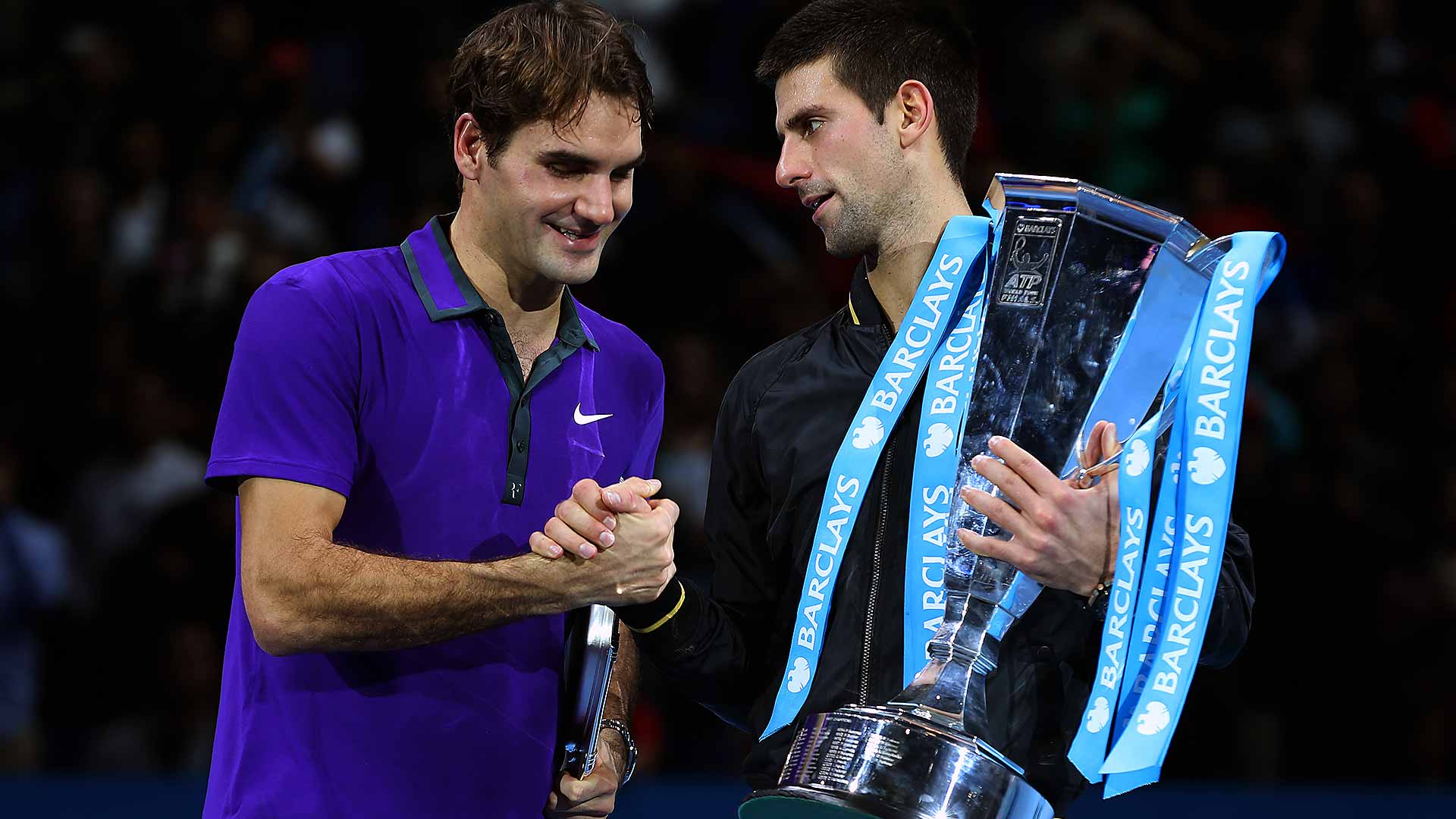 Roger Federer congratulates Novak Djokovic on his victory at the 2012 Barclays ATP World Tour Finals.