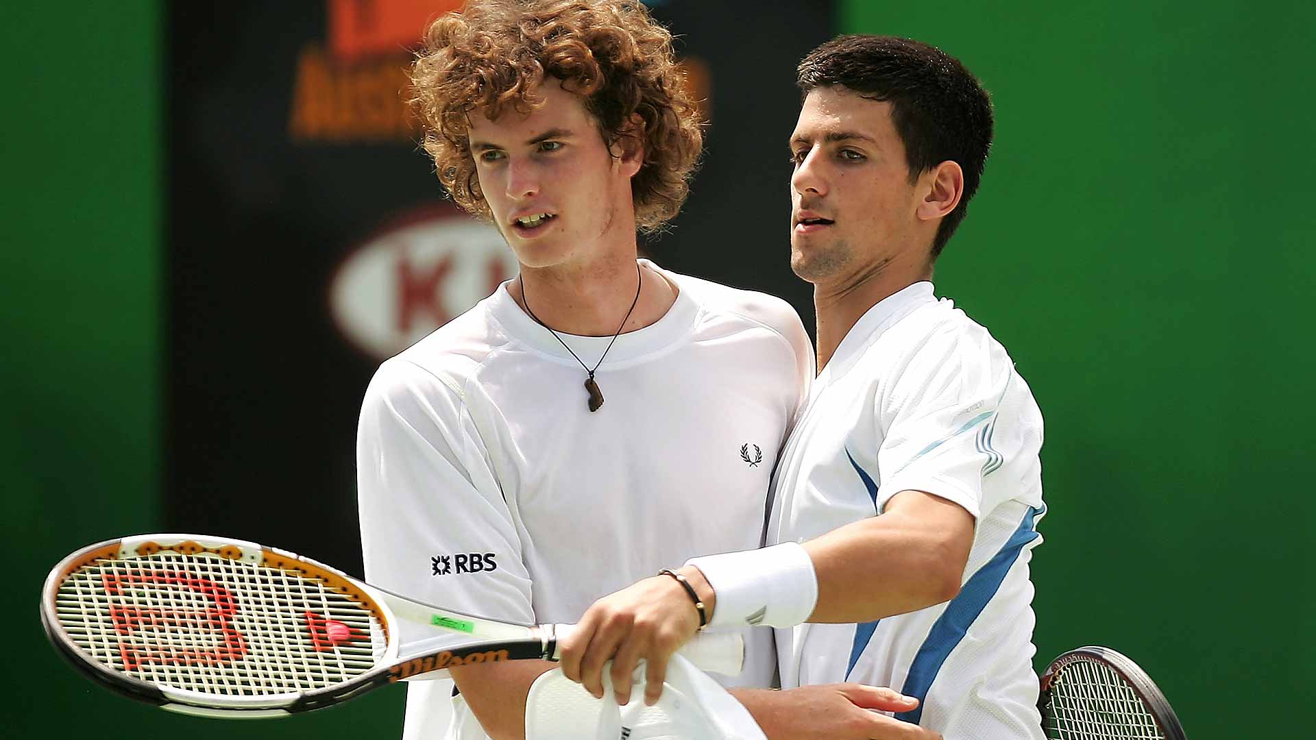 Andy Murray and Novak Djokovic team up at the 2006 Australian Open, just months before their first FedEx ATP Head2Head meeting.