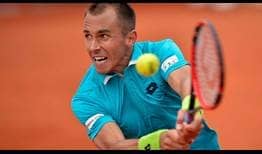 Lukas Rosol battles into the Bucharest quarter-finals with a 4-6, 6-4, 6-3 win over Dusan Lajovic.