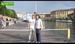 Filippo Volandri (L) and Marco Cecchinato enjoy a hit on the boathouse on the Naviglio river.