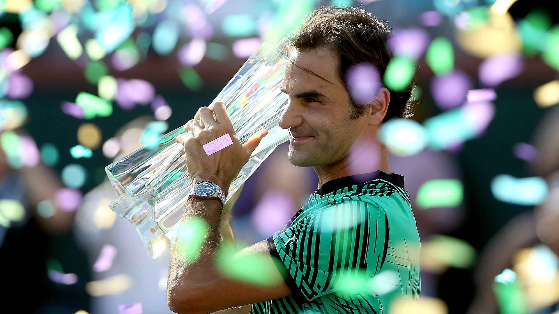 Roger Federer celebrates his record-tying fifth BNP Paribas Open title in Indian Wells.
