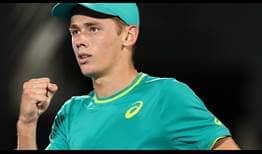 Teenager Alex de Minaur celebrates saving seven of eight break points on Friday night against Benoit Paire for a place in the Sydney final.