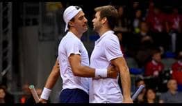 Steve Johnson and Ryan Harrison clinch the United States' 3-0 victory against Serbia, the country's first win in three tries against Serbia.