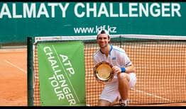 Jurij Rodionov lifts his maiden ATP Challenger Tour trophy in Almaty, Kazakhstan.