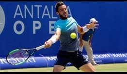 Damir Dzumhur records just the fifth grass-court match win of his career on Thursday over Pierre-Hugues Herbert at the Antalya Open.