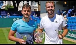Jonny O'Mara and Luke Bambridge celebrate winning their first ATP World Tour title at Devonshire Park in Eastbourne.