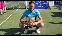 Damir Dzumhur beats Adrian Mannarino in three sets at the Turkish Airlines Open Antalya to lift his third tour-level title on Saturday.