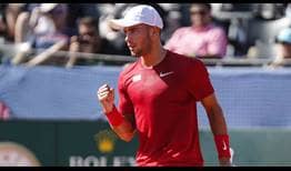 Borna Coric defeats Frances Tiafoe in five sets to book Croatia's spot in November's Davis Cup final against France.