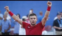 Borna Coric rallies from two sets to one down to beat Frances Tiafoe in the Davis Cup World Group Semi-finals on Sunday.