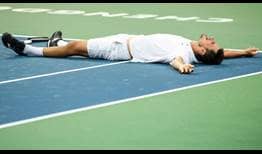 Bernard Tomic celebrates winning his fourth ATP World Tour title on Sunday at the Chengdu Open, where he saved four match points to beat Fabio Fognini.