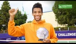 Felix Auger-Aliassime lifts the trophy at the ATP Challenger Tour event in Tashkent, Uzbekistan.